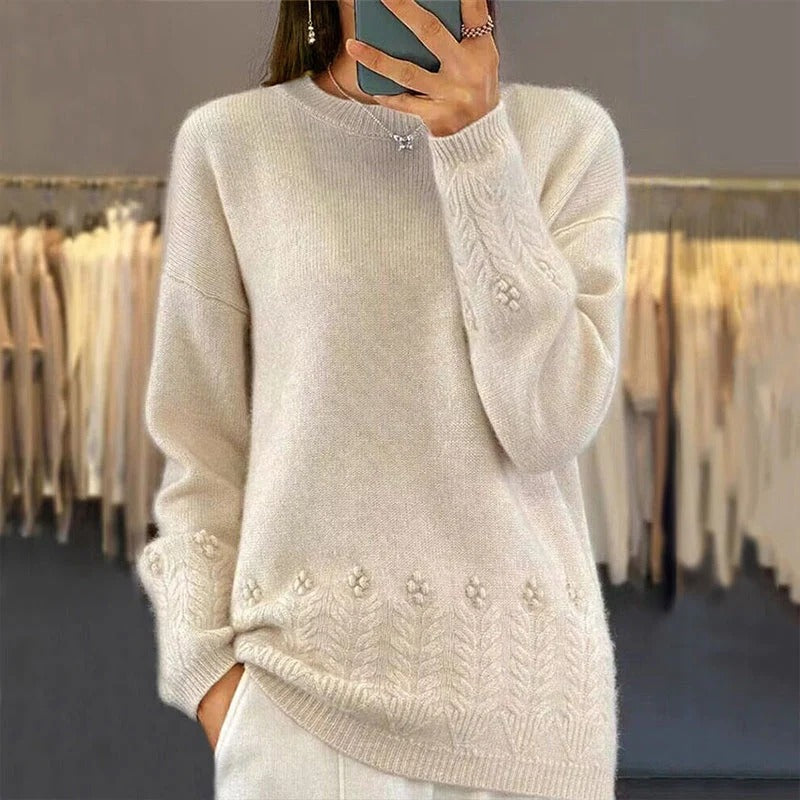Women's sweater with round neck and cable pattern