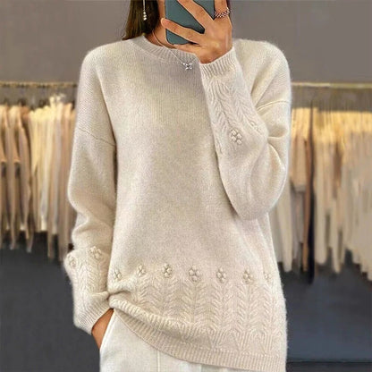 Women's sweater with round neck and cable pattern