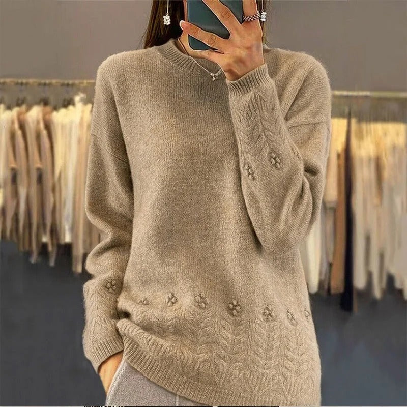Women's sweater with round neck and cable pattern